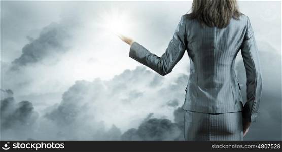 Business perspective. Back view of businesswoman against nature background