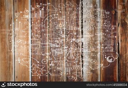 Business plan. Business ideas and sketch on wooden surface