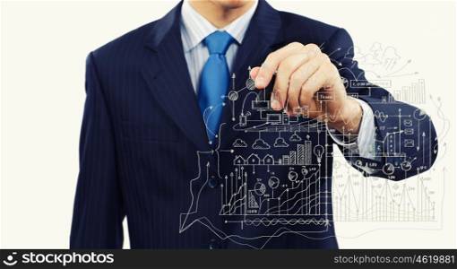 Business plan. Close up of businessman drawing business sketches