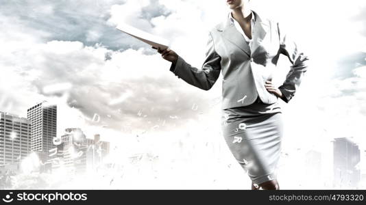 Business plan. Close up of confident businesswoman against city background