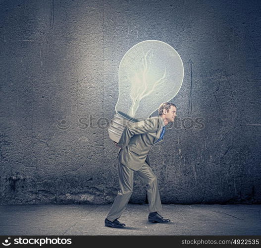 Business plan. Image of businessman carrying bulb on back. New idea