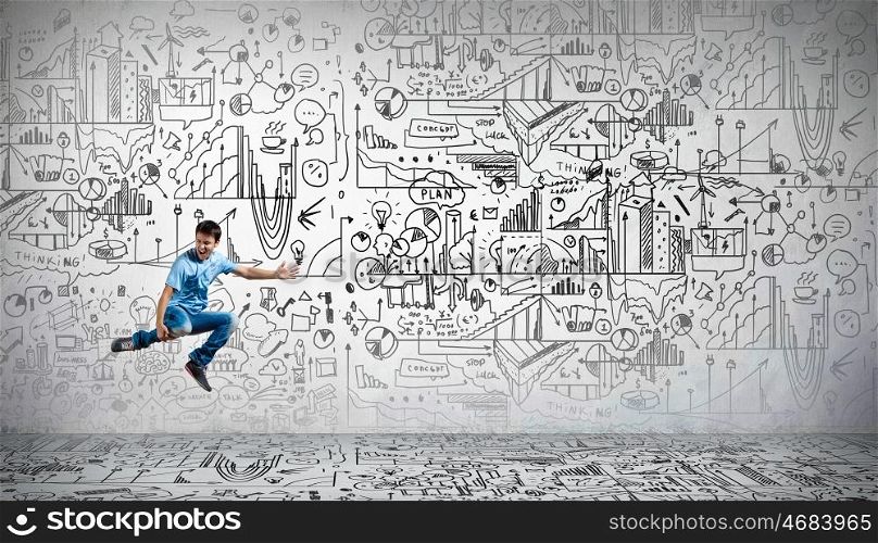 Business planning. Funny image of running businessman on background of business plan