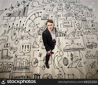 Business planning. Top view of young businessman with tie around head