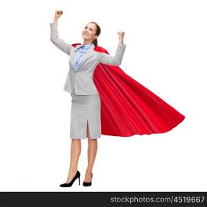business, power, success, achievement and people concept - young smiling businesswoman in red superhero cape holding raised fists