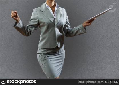 Business presentation. Bottom view of businesswoman holding pen in hand