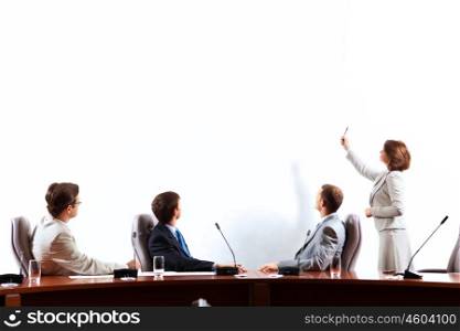 Business presentation. Image of businesspeople at presentation looking at screen. Space for advertisment