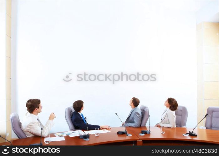 Business presentation. Image of businesspeople at presentation looking at screen. Space for advertisment