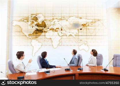 Business presentation. Image of businesspeople at presentation looking at virtual project
