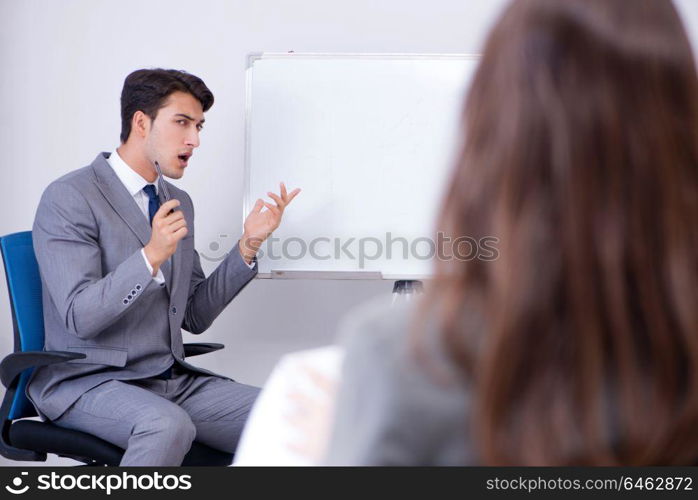 Business presentation in the office with man and woman