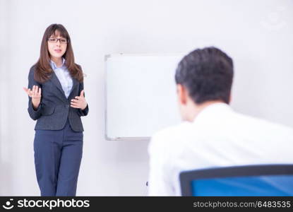 Business presentation in the office with man and woman