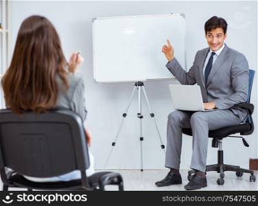 Business presentation in the office with man and woman. The business presentation in the office with man and woman