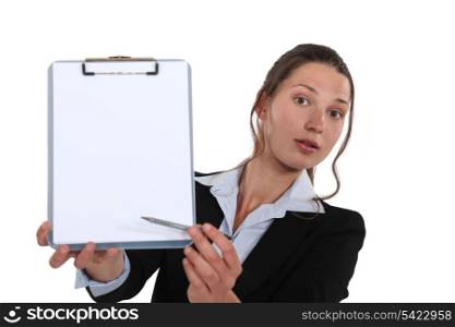 Business professional pointing to a clipboard