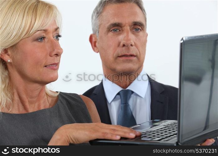 Business professionals looking at a website