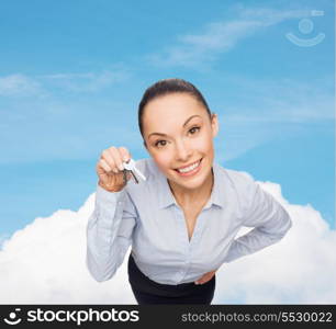 business, real estate and banking concept - smiling businesswoman with house keys