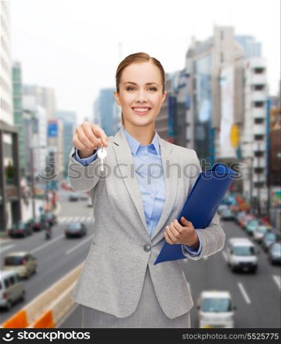 business, real estate, banking and office concept - smiling businesswoman with folder and keys