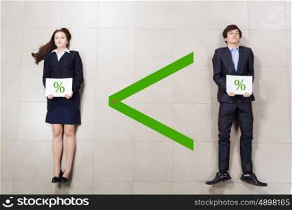 Business relations. Funny businessman and woman lying on floor. Competition concept