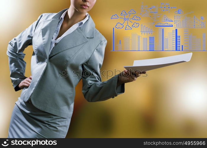 Business report. Close up of businesswoman with papers in hands