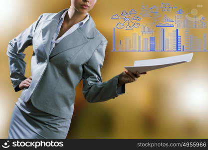 Business report. Close up of businesswoman with papers in hands