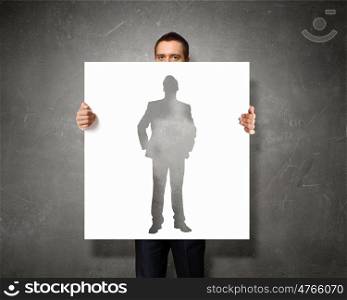Business seminar. Businessman holding banner with business leadership concepts