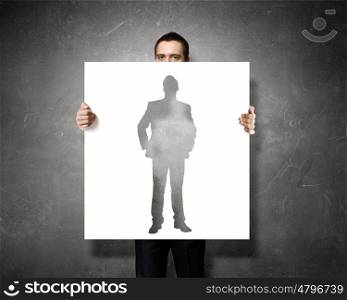 Business seminar. Businessman holding banner with business leadership concepts
