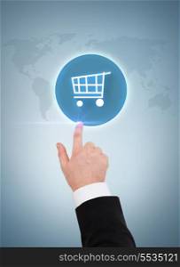 business, shopping and advertisement concept - close up of businessman pointing to shopping cart button