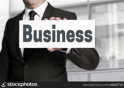 Business sign is held by businessman concept. Business sign is held by businessman concept.