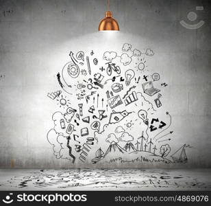 Business sketch on wall. Drawn business plan on wall illuminated by lamp above