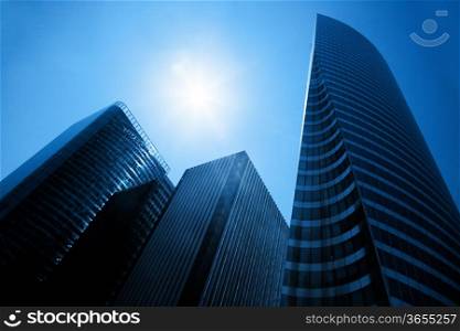 Business skyscrapers, sunny blue sky. La Defense financial district in Paris, France.