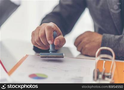 Business stamping rubber Stamp on a documents - business concept