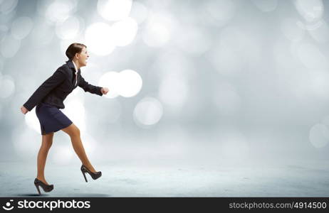 Business start. Side view of businesswoman standing in start position