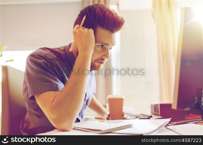 business, startup and people concept - businessman or creative male office worker drinking coffee and thinking