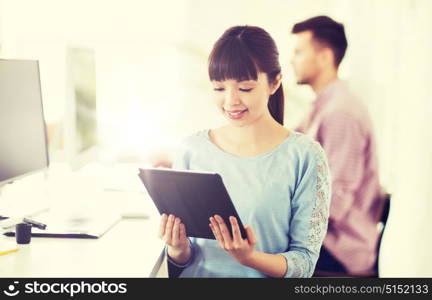 business, startup and people concept - happy asian businesswoman or creative female office worker with tablet pc computer. happy creative female office worker with tablet pc