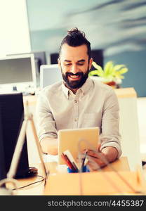 business, startup and people concept - happy businessman or creative male office worker with tablet pc computer