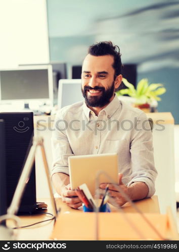 business, startup and people concept - happy businessman or creative male office worker with tablet pc computer