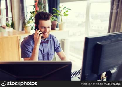 business, startup and people concept - happy businessman or creative male office worker with computer calling on smarphone