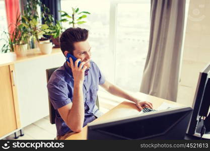 business, startup and people concept - happy businessman or creative male office worker with computer calling on smarphone