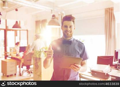business, startup and people concept - happy businessman or creative male office worker with tablet pc computer