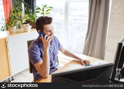 business, startup and people concept - happy businessman or creative male office worker with computer calling on smarphone