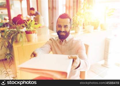 business, startup and people concept - happy businessman or creative male office worker giving folder