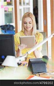 business, startup and people concept - happy businesswoman or creative woman with tablet pc computer at office