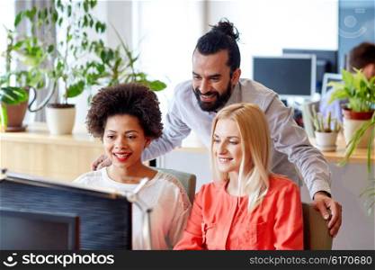 business, startup and people concept - happy creative team networking with computer in office