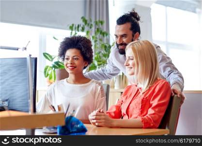 business, startup and people concept - happy creative team networking with computer in office