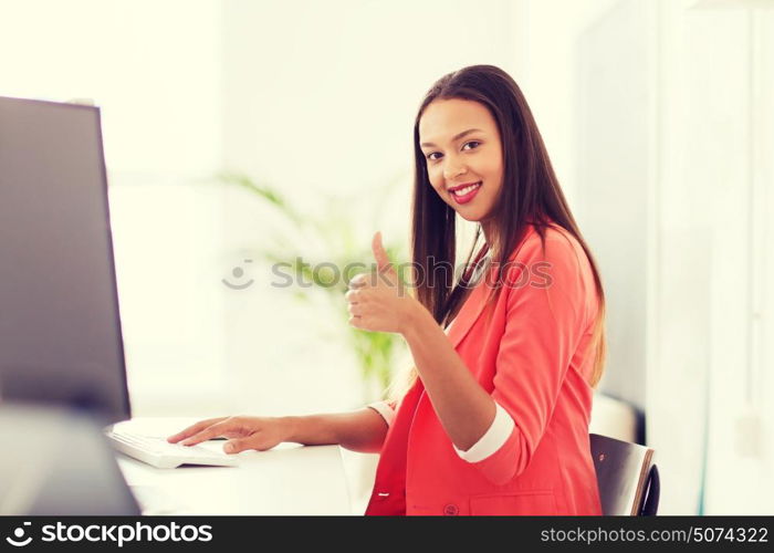 business, startup, education and people concept - happy young african woman with computer working at office and showing thumbs up. happy african woman with computer at office