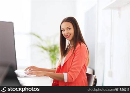 business, startup, education and people concept - happy young african woman with computer working at office