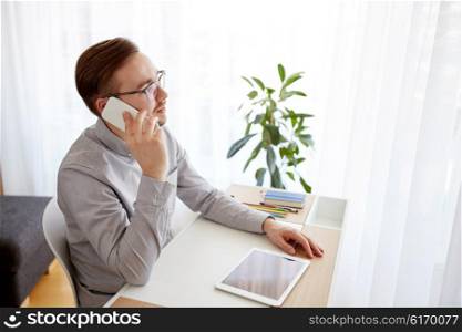 business, startup, technology, communication and people concept - businessman or creative male worker with computer calling on smarphone at home office