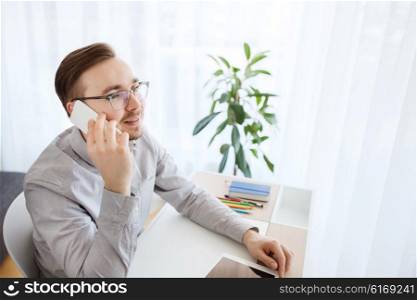 business, startup, technology, communication and people concept - happy businessman or creative male worker with computer calling on smarphone at home office