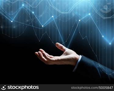 business, statistics and people concept - close up of businessman hand with diagram charts over dark background. close up of businessman hand