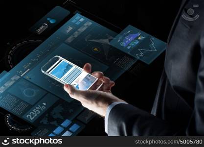 business, statistics, people and future technology concept - close up of businessman hand with charts on transparent smartphone screen and virtual projections over black background. close up of businessman with charts on smartphone