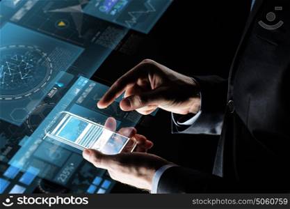 business, statistics, people and future technology concept - close up of businessman hands with charts on transparent smartphone screen and virtual projections over black background. close up of businessman with charts on smartphone