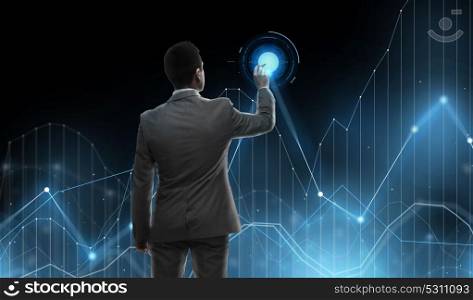 business, statistics, people and technology concept - businessman with marker and virtual chart projection from back over black background. businessman working with virtual chart projection